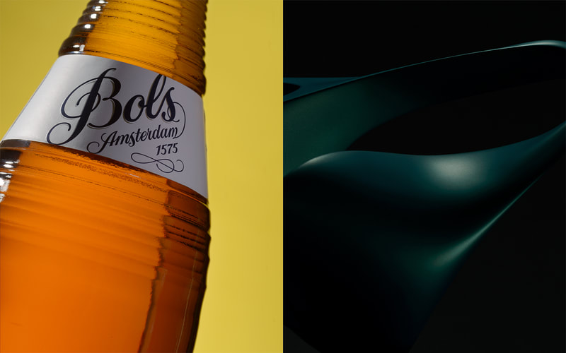 A pair of images. On the left is a bottle of Bols pear brandy and on the right is a dark and moody sculpture in blue tones. Both photographed in studio in Peterborough Ontario Canada by Mike Taylor.