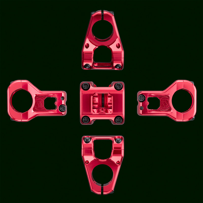 A set of images of red coloured bike parts in the shape of a plus sign, on top of a very dark surface.