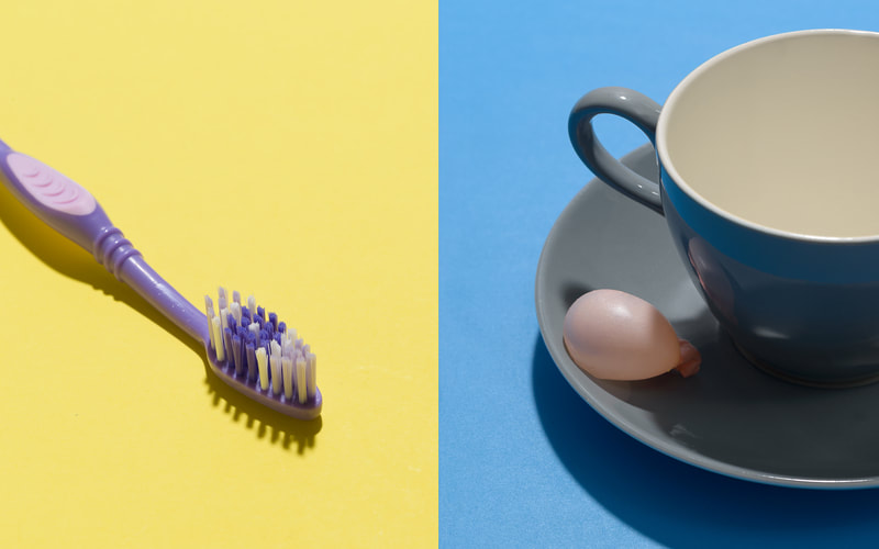 A pair of images. On the left is a single purple toothbrush on a yellow surface. On the right is a simple grey and white tea cup and saucer with a bubble gum bubble on a blue surface.