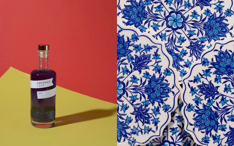 A pair of images. On the left is an image of a bottle of gin on a yellow surface with a red background. On the right is a closeup image of blue floral patterned drinks coasters.