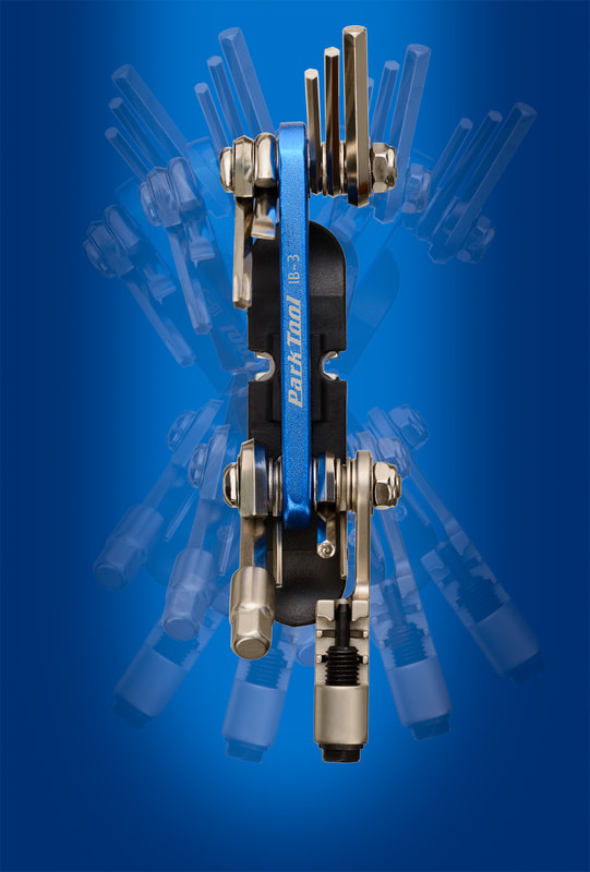Park IB-3 multitool with chain tool against a blue background. Shot by professional photographer Mike Taylor in Peterborough Ontario.