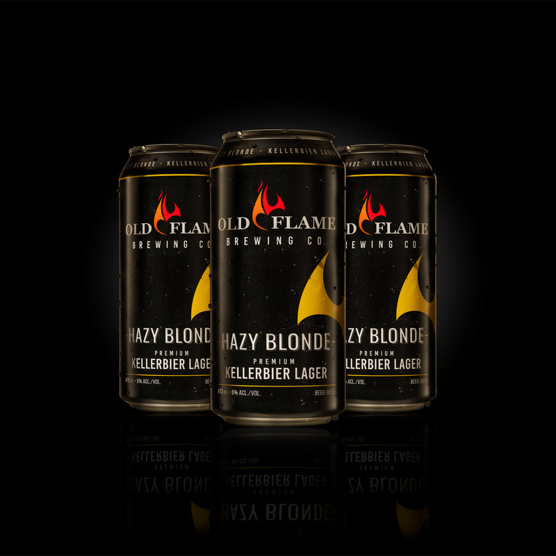 A trio of black beer cans against a black background. Photographed by Mike Taylor in his Peterborough Ontario Canada studio.