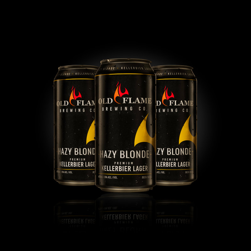 a trio of black cans of beer stand guard in a black background
